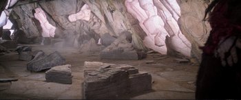 Movie still from “The Dark Crystal” (1982), directed by Frank Oz – A room filled with rocks in a cave; Extreme Wide shot, High angle