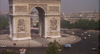 Movie still from “The Day of the Jackal” (1973), directed by Fred Zinnemann – A view of the arc de triomphe in paris , france; Extreme Wide shot, High angle
