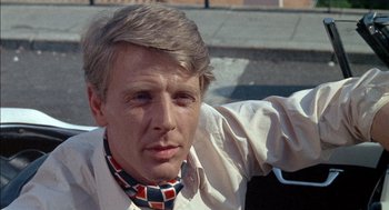 Movie still from “The Day of the Jackal” (1973), directed by Fred Zinnemann – A person wearing a neck tie; Close Up shot, Low angle