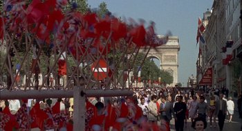Movie still from “The Day of the Jackal” (1973), directed by Fred Zinnemann – A crowd of people walking down a street; Extreme Wide shot, High angle