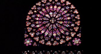 Movie still from “The Day of the Jackal” (1973), directed by Fred Zinnemann – A stained - glass rose window in a cathedral; Extreme Wide shot, Low angle
