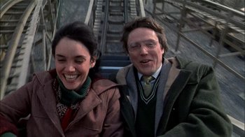 Movie still from “The Dead Zone” (1983), directed by David Cronenberg – A man and a woman smiling for the camera; Close Up shot, High angle