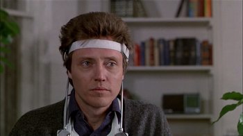 Movie still from “The Dead Zone” (1983), directed by David Cronenberg – A man with a headband on his head; Close Up shot, Low angle