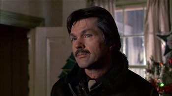 Movie still from “The Dead Zone” (1983), directed by David Cronenberg – A person wearing a jacket; Close Up shot, Low angle