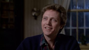 Movie still from “The Dead Zone” (1983), directed by David Cronenberg – A person wearing a sweater smiling; Close Up shot, Over the shoulder angle