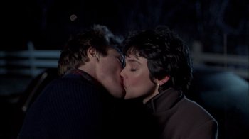 Movie still from “The Dead Zone” (1983), directed by David Cronenberg – A couple of people that are kissing in the dark; Close Up shot, Over the shoulder angle