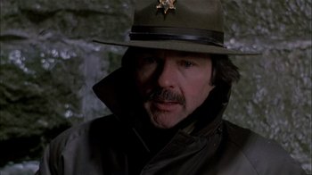 Movie still from “The Dead Zone” (1983), directed by David Cronenberg – A person wearing a hat; Close Up shot, Low angle