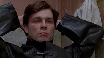 Movie still from “The Dead Zone” (1983), directed by David Cronenberg – A person wearing a leather jacket; Close Up shot, Low angle