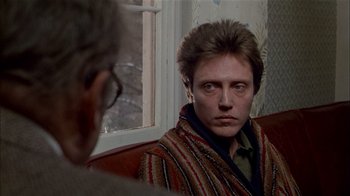 Movie still from “The Dead Zone” (1983), directed by David Cronenberg – A man sitting in front of a mirror looking at himself in the mirror; Close Up shot, Over the shoulder angle