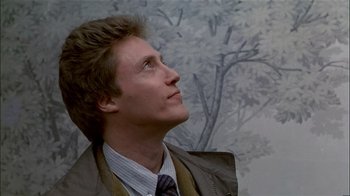 Movie still from “The Dead Zone” (1983), directed by David Cronenberg – A person looking up at a tree; Close Up shot, Low angle