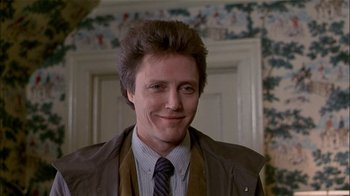 Movie still from “The Dead Zone” (1983), directed by David Cronenberg – A person wearing a suit and tie; Close Up shot, Low angle