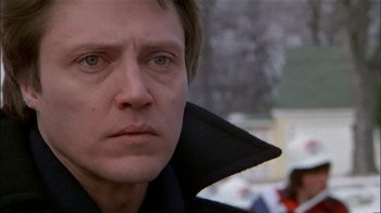 Movie still from “The Dead Zone” (1983), directed by David Cronenberg – A person wearing a black jacket; Close Up shot, Low angle