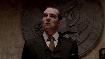 Movie still from “The Dead Zone” (1983), directed by David Cronenberg – A man in a suit and a tie; Close Up shot, Low angle