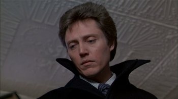 Movie still from “The Dead Zone” (1983), directed by David Cronenberg – A person wearing a suit and tie; Close Up shot, Low angle