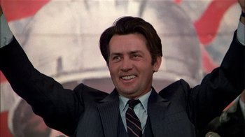 Movie still from “The Dead Zone” (1983), directed by David Cronenberg – A person wearing a suit and tie; Close Up shot, Low angle