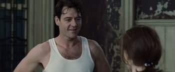 Movie still from “The Debt” (2010), directed by John Madden – A person wearing a tank top; Close Up shot, Over the shoulder angle