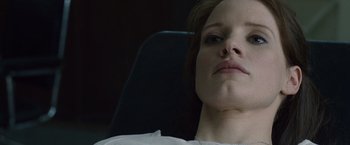 Movie still from “The Debt” (2010), directed by John Madden – A person laying in a chair; Close Up shot, Low angle