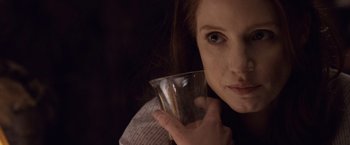 Movie still from “The Debt” (2010), directed by John Madden – A person holding a cup; Close Up shot, Over the shoulder angle