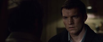 Movie still from “The Debt” (2010), directed by John Madden – A person wearing a jacket; Close Up shot, Over the shoulder angle