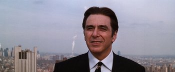 Movie still from “The Devil's Advocate” (1997), directed by Taylor Hackford – A person wearing a suit and tie; Close Up shot, Low angle