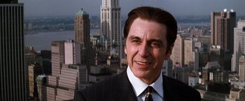 Movie still from “The Devil's Advocate” (1997), directed by Taylor Hackford – A person wearing a suit and tie; Close Up shot, Low angle