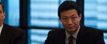 Movie still from “The Devil's Advocate” (1997), directed by Taylor Hackford – A person wearing a suit and tie; Close Up shot, Low angle