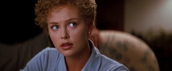 Movie still from “The Devil's Advocate” (1997), directed by Taylor Hackford – A person wearing a blue shirt; Close Up shot, Over the shoulder angle