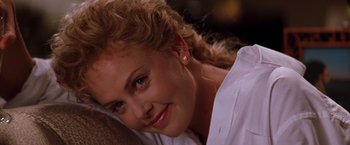 Movie still from “The Devil's Advocate” (1997), directed by Taylor Hackford – A woman's face in a white shirt; Close Up shot, Over the shoulder angle