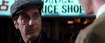 Movie still from “The Devil's Advocate” (1997), directed by Taylor Hackford – A person wearing a hat; Close Up shot, Over the shoulder angle