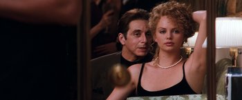 Movie still from “The Devil's Advocate” (1997), directed by Taylor Hackford – A man and a woman in front of a mirror; Close Up shot, Over the shoulder angle