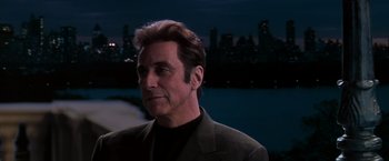 Movie still from “The Devil's Advocate” (1997), directed by Taylor Hackford – A person wearing a suit; Close Up shot, Over the shoulder angle