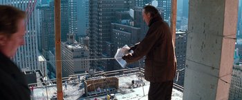 Movie still from “The Devil's Advocate” (1997), directed by Taylor Hackford – A man standing on top of a tall building; Wide shot, High angle