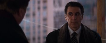 Movie still from “The Devil's Advocate” (1997), directed by Taylor Hackford – A person wearing a suit and tie; Close Up shot, Low angle
