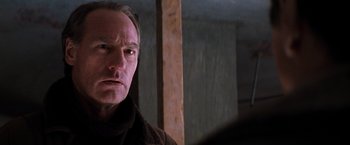 Movie still from “The Devil's Advocate” (1997), directed by Taylor Hackford – A person wearing a coat; Close Up shot, Low angle