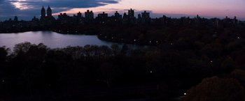 Movie still from “The Devil's Advocate” (1997), directed by Taylor Hackford – A view of a city at night from a hill; Extreme Wide shot, High angle