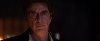 Movie still from “The Devil's Advocate” (1997), directed by Taylor Hackford – A person wearing a suit and tie; Close Up shot, Over the shoulder angle