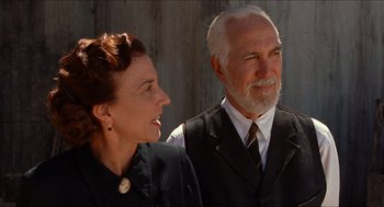 Movie still from “The Devil's Backbone” (2001), directed by Guillermo del Toro – An older man standing next to an older woman; Close Up shot, Low angle