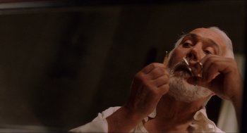 Movie still from “The Devil's Backbone” (2001), directed by Guillermo del Toro – An older man brushing his teeth with a tooth brush; Extreme Close Up shot, Low angle