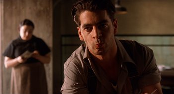 Movie still from “The Devil's Backbone” (2001), directed by Guillermo del Toro – A man with a beard is posing for a picture; Close Up shot, Low angle