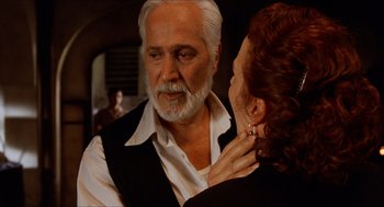 Movie still from “The Devil's Backbone” (2001), directed by Guillermo del Toro – An older man and a younger woman are looking at one another; Close Up shot, Over the shoulder angle