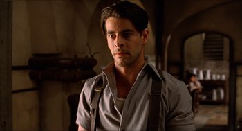 Movie still from “The Devil's Backbone” (2001), directed by Guillermo del Toro – A person wearing suspenders; Close Up shot, Low angle