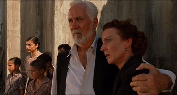 Movie still from “The Devil's Backbone” (2001), directed by Guillermo del Toro – An older man and a younger woman standing next to each other; Medium shot, Low angle