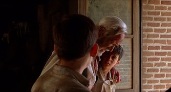 Movie still from “The Devil's Backbone” (2001), directed by Guillermo del Toro – A group of young men standing next to each other in a room; Close Up shot, Over the shoulder angle