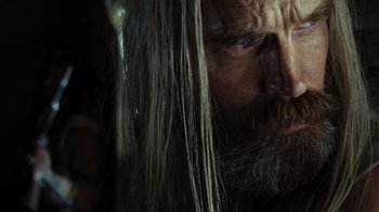 Movie still from “The Devil's Rejects” (2005), directed by Rob Zombie – A man with long hair; Close Up shot, Over the shoulder angle