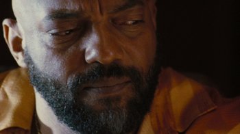 Movie still from “The Devil's Rejects” (2005), directed by Rob Zombie – A person with a beard; Extreme Close Up shot, High angle