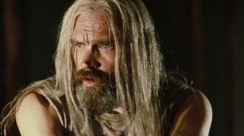 Movie still from “The Devil's Rejects” (2005), directed by Rob Zombie – A man with long white hair and a beard; Close Up shot, Low angle