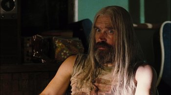 Movie still from “The Devil's Rejects” (2005), directed by Rob Zombie – A man with long white hair and a long beard; Close Up shot, Over the shoulder angle