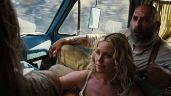 Movie still from “The Devil's Rejects” (2005), directed by Rob Zombie – A man and a woman sitting in a car; Medium shot, Low angle