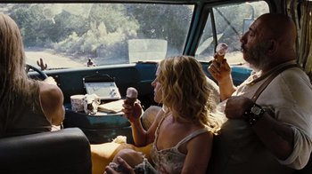 Movie still from “The Devil's Rejects” (2005), directed by Rob Zombie – Two people sitting in a car eating ice cream; Medium shot, Over the shoulder angle