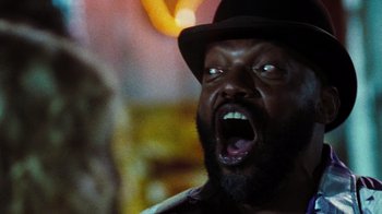 Movie still from “The Devil's Rejects” (2005), directed by Rob Zombie – A person wearing a hat; Close Up shot, Low angle